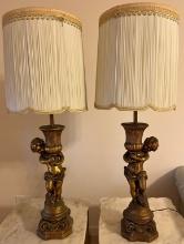 Pair of Cherub Plaster Lamps Holding Urns with Scalloped and Pleated Shades
