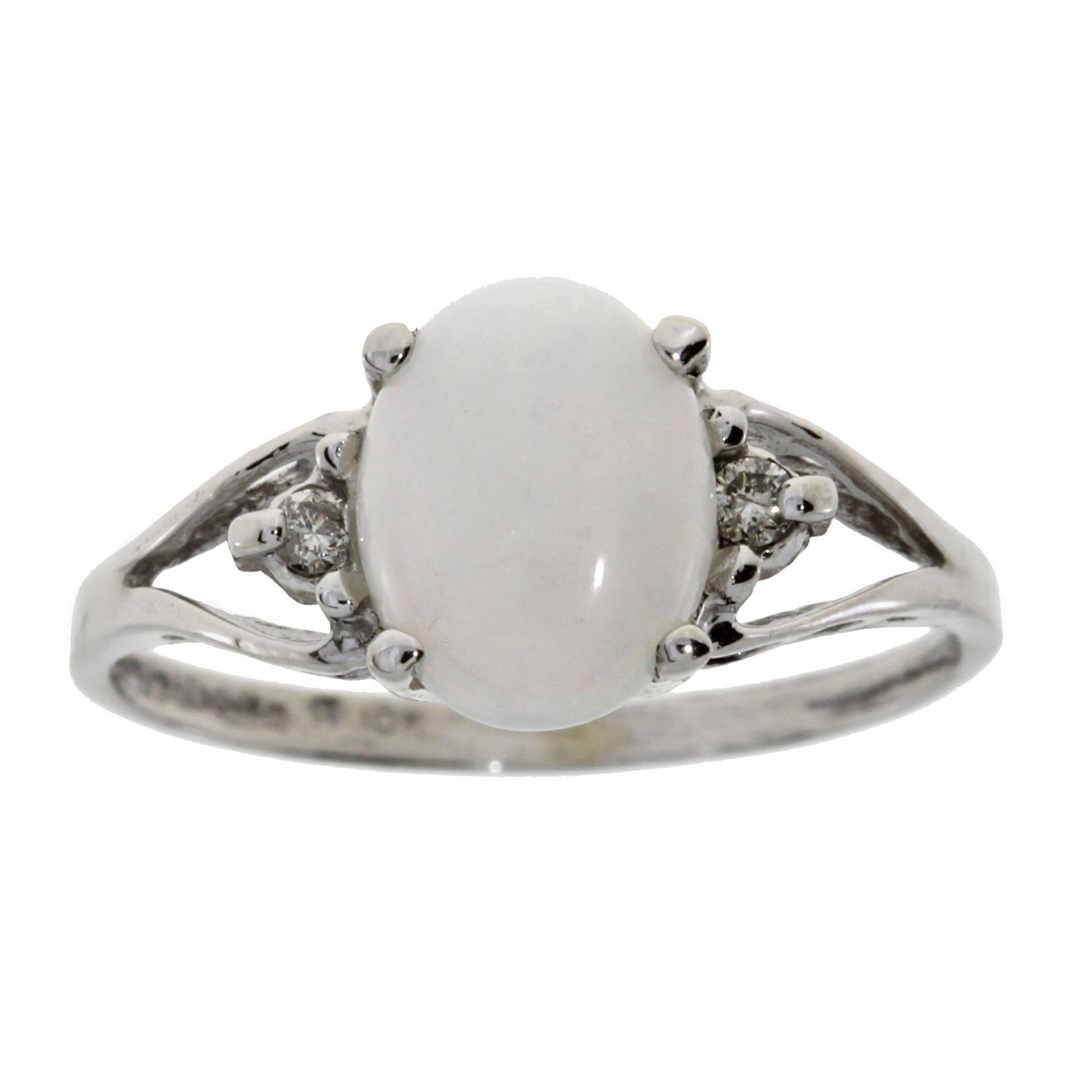 Opal and 0.05ct Diamond ring in 10kt White Gold. Ring size 7. Diamonds are I-J color, round, I1-I3 c