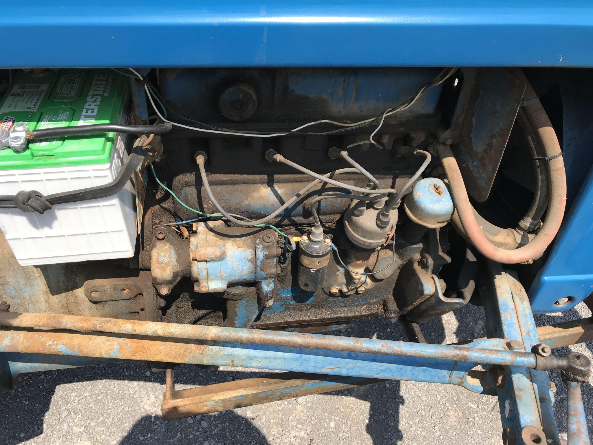 Ford model 2000 tractor, converted to propane, showing 1294hrs, 4 speed, draw bar, 2 propane tanks, 