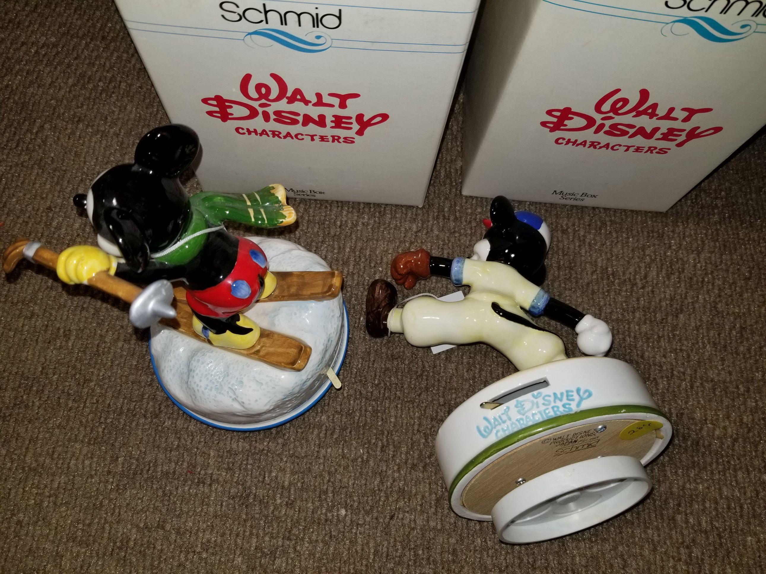 2 Schmid Disney music boxes.  One has been repairded