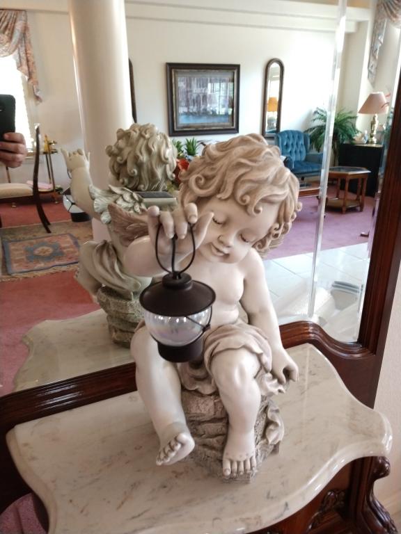 Cherub with a lantern table top statue