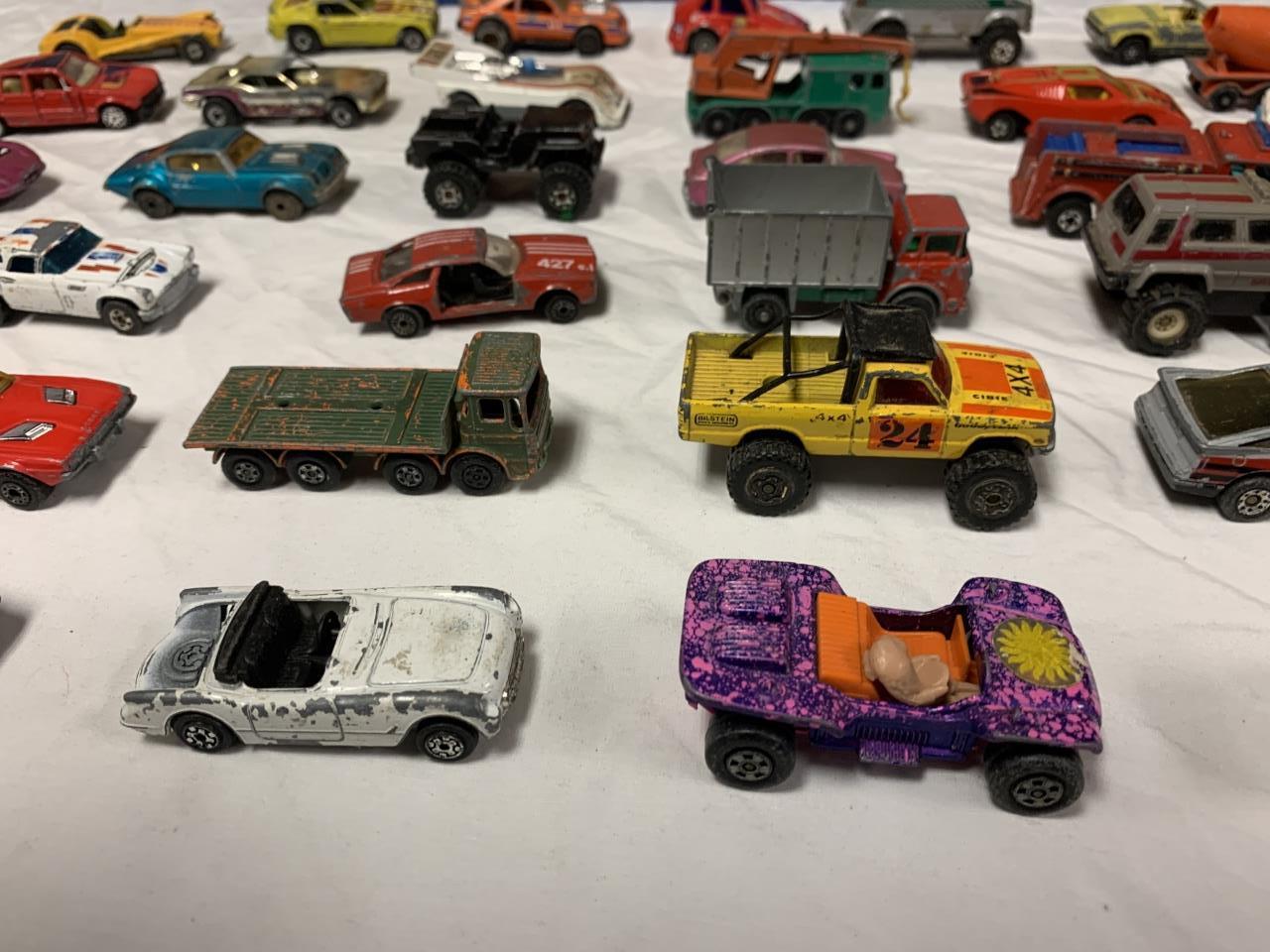 33 Vintage Hot Wheel Diecast vehicles w/ Case