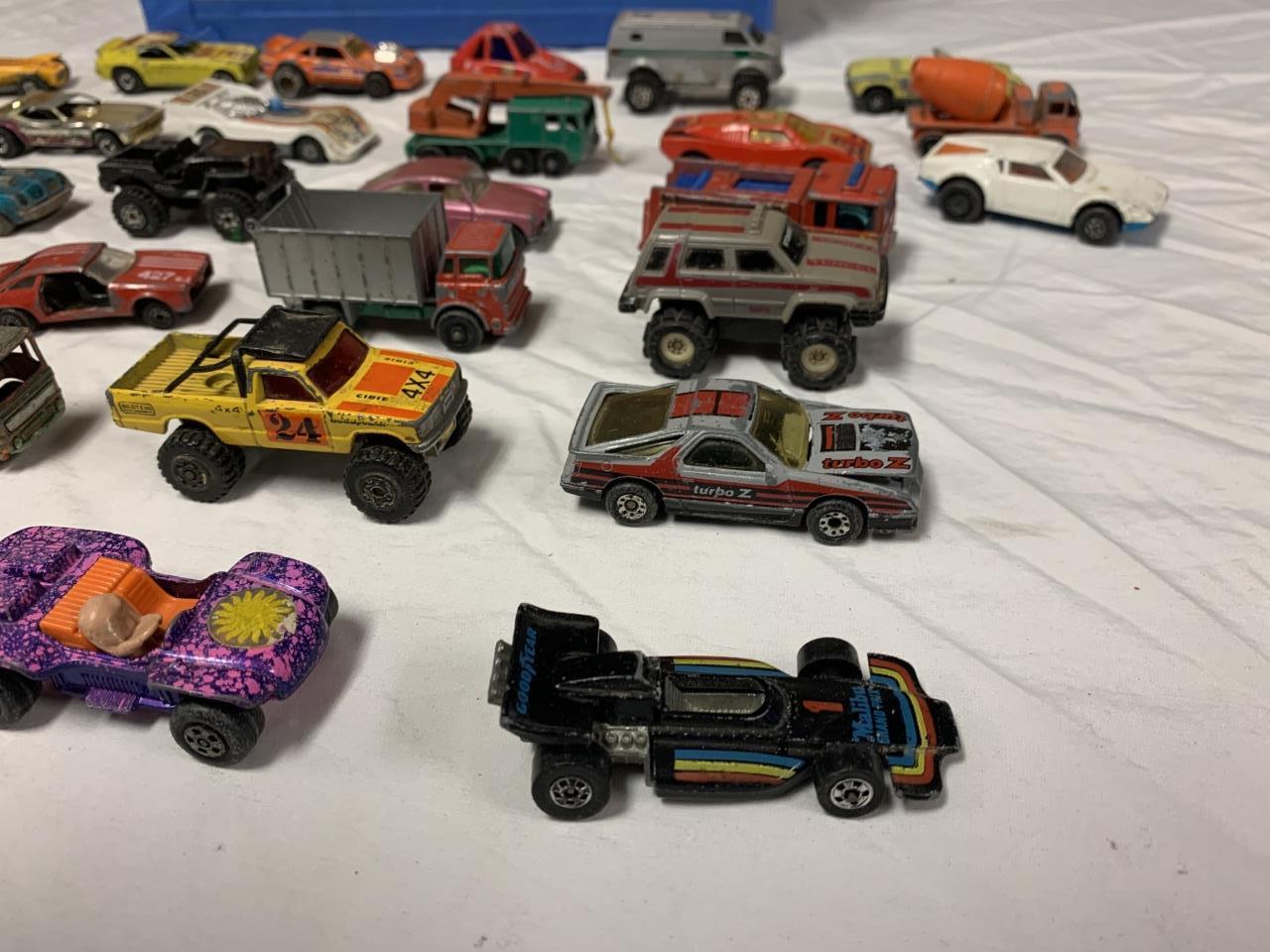 33 Vintage Hot Wheel Diecast vehicles w/ Case