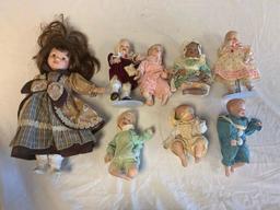 Lot of 8 porcelain Dolls with 7 Toddlers Dolls