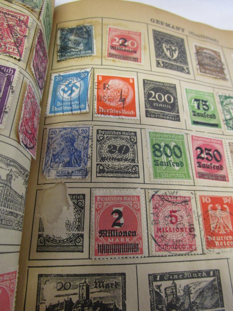 Vintage Around-The-World stamp book with over 500 vintage stamps