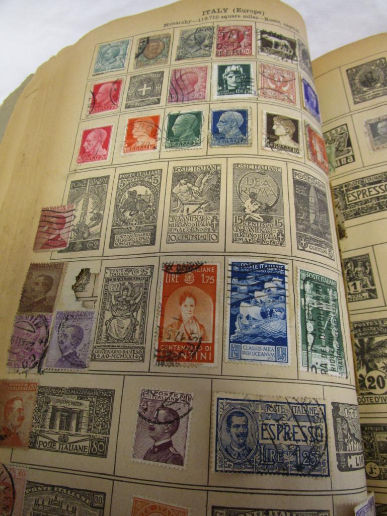 Vintage Around-The-World stamp book with over 500 vintage stamps