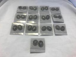 Lot of 17 Identical Silver-Tone Pierced Earrings.