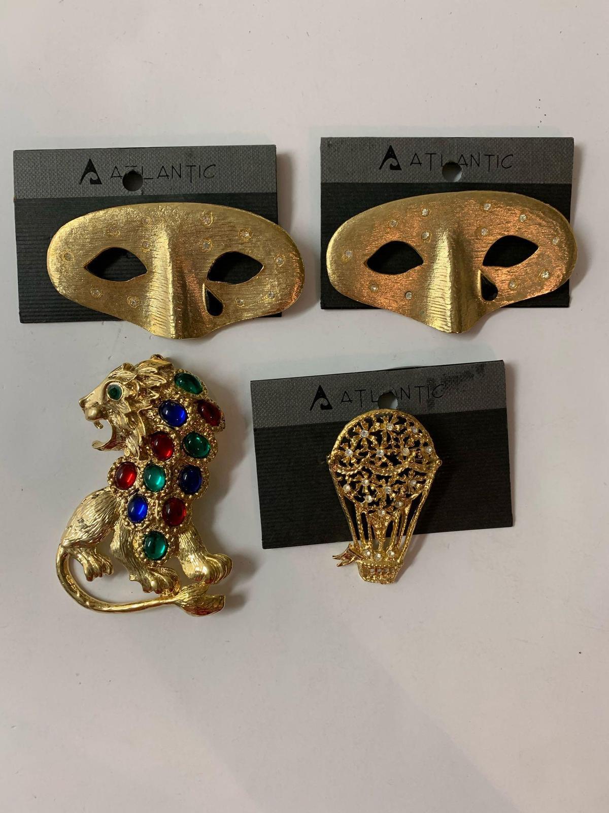 Lot of four vintage costume jewelry brooches