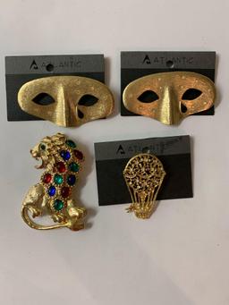 Lot of four vintage costume jewelry brooches