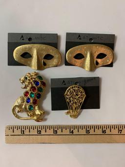 Lot of four vintage costume jewelry brooches