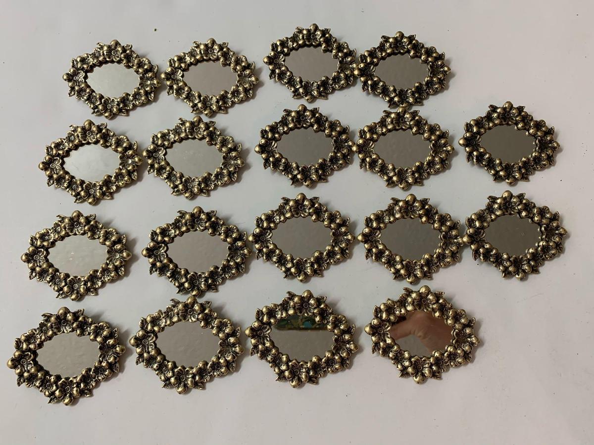 Lot of 18 vintage mirror brooches.