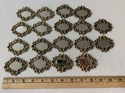 Lot of 18 vintage mirror brooches.