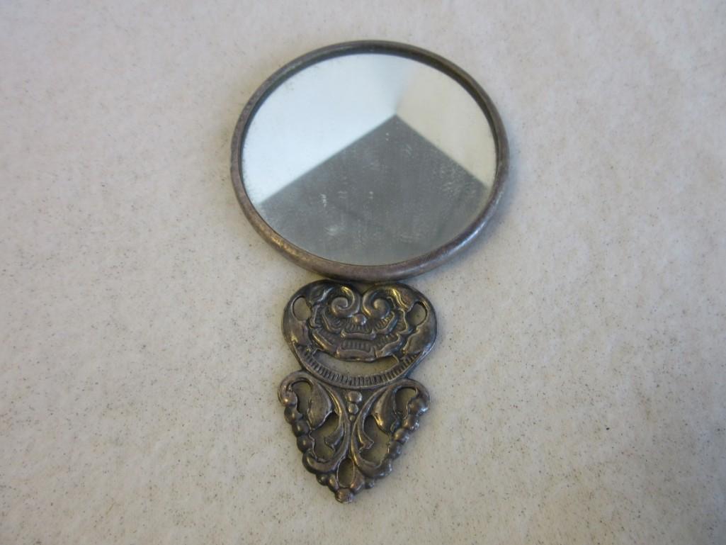 Small Sterling Silver Hand-Held Mirror with Relief Design on the Back (56.8 grams)