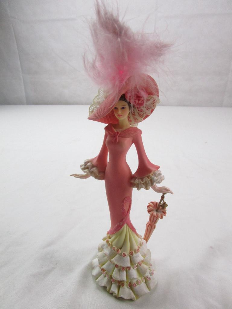 Ceramic fancy lady figurine with a parasol; breast cancer commemorative by Thomas Kinkade......