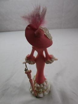 Ceramic fancy lady figurine with a parasol; breast cancer commemorative by Thomas Kinkade......