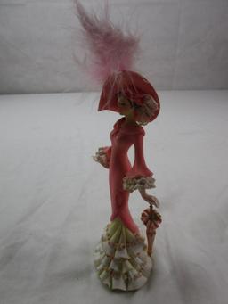 Ceramic fancy lady figurine with a parasol; breast cancer commemorative by Thomas Kinkade......