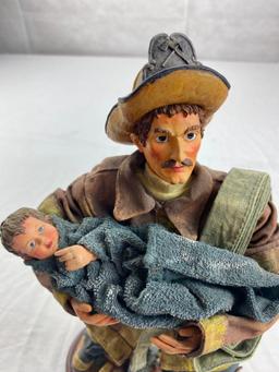 Cloth Fireman figure carrying small child