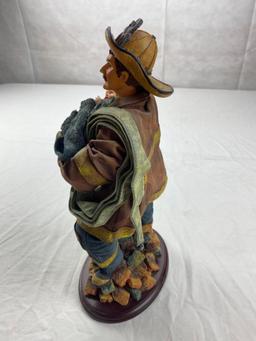 Cloth Fireman figure carrying small child