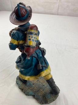 Plastic Fireman figure walking with small child