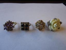 Lot of 4 ladies costume jewelry rings: cluster stones and flower