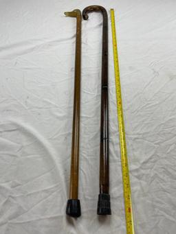 Two wood walking canes