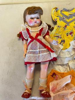 Vintage doll with large lot of clothing