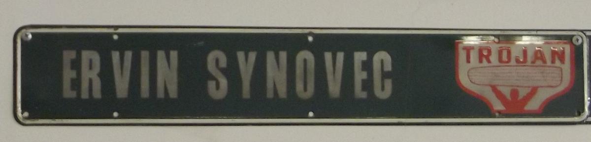 Synovec Metal Trojans Sign, 4” x 21”,  Very Good Condition.