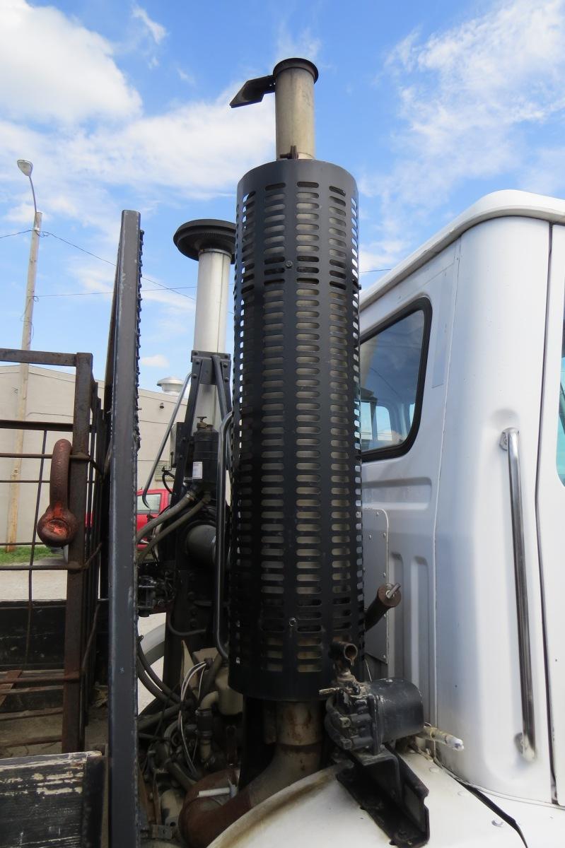 1987 White Single Axle Flatbed Truck.