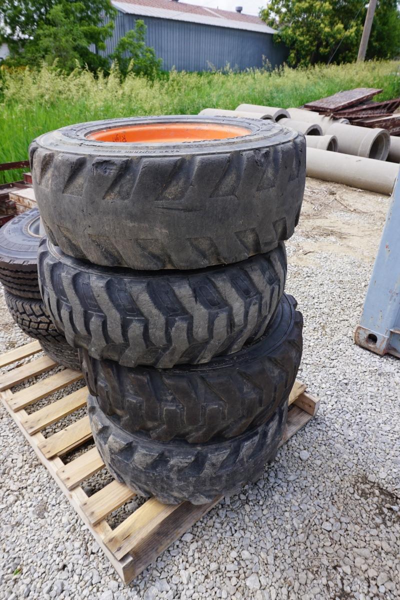 (4) 10-16.5 Bobcat Skidsteer Tires w/ Wheels.