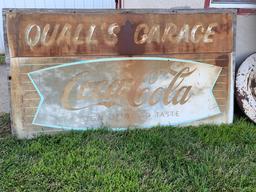 Quall's Garage Coca-Cola Metal Sign, Mounted on Wood Board, 71" Wide x 39" Tall.
