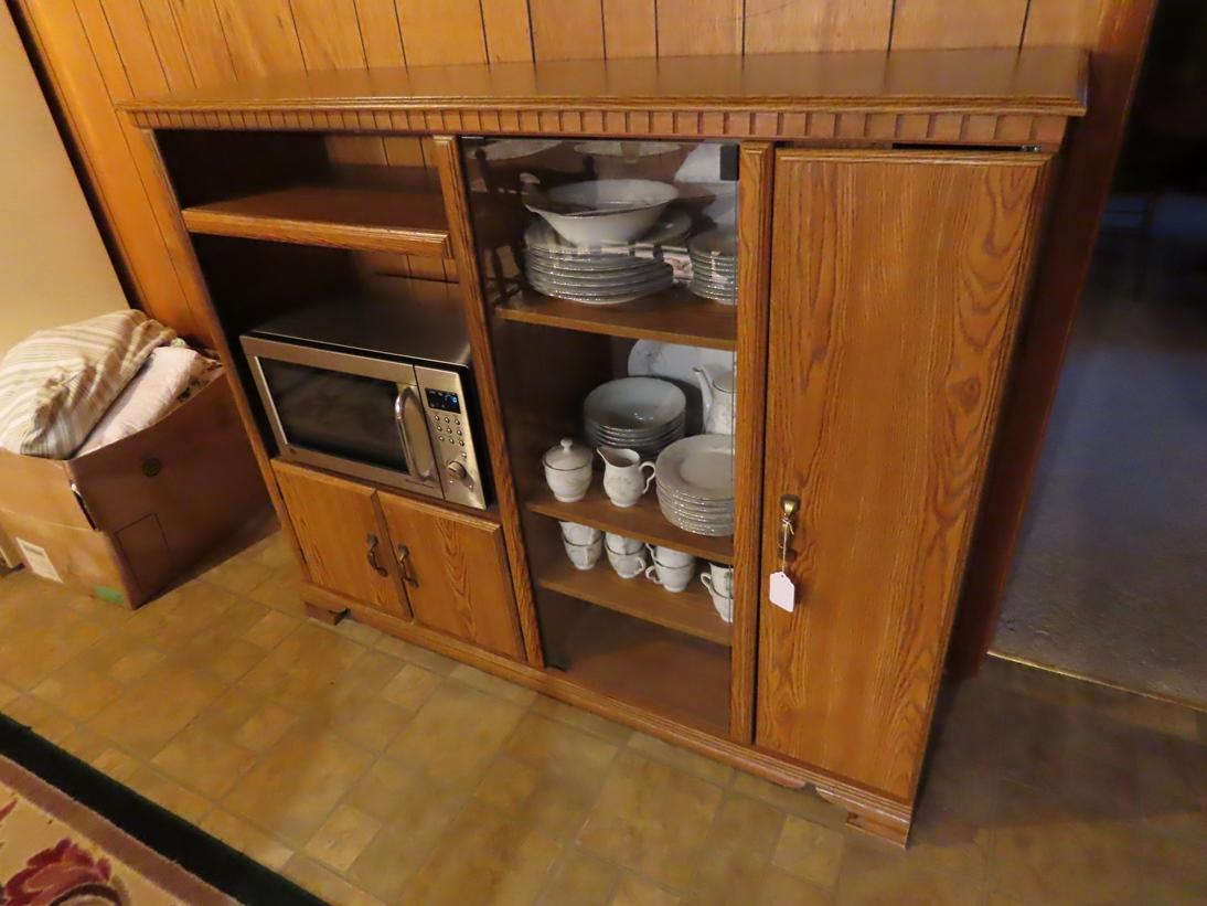 Wood Entertainment Center with GE Stainless Steel Microwave.