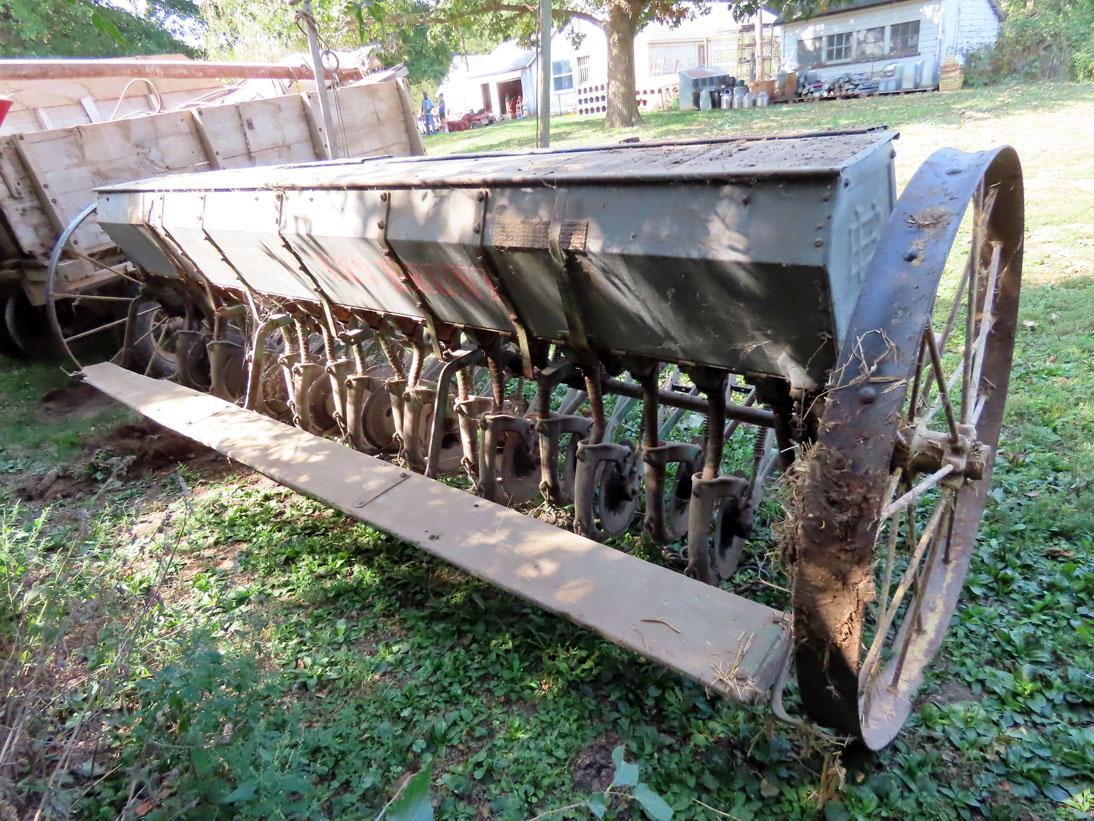 John Deere Van Brunt End Wheel Drill on Steel, 18-Shoe, Grass Seed Attachment, Single Disc Opener.