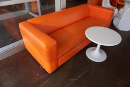 6' Orange Low Couch & Round Plastic White Table.