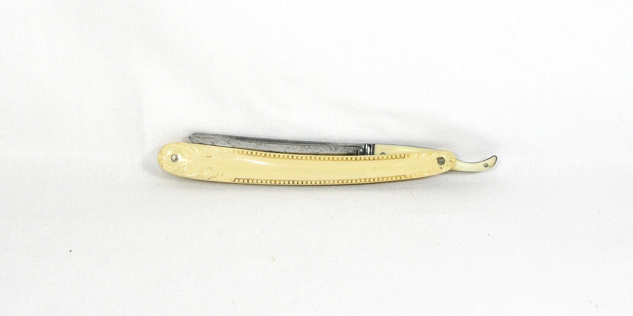 C.F. Wolfertz,  Allentown, PA  (faint) Hollowpoint blade straight razor wit