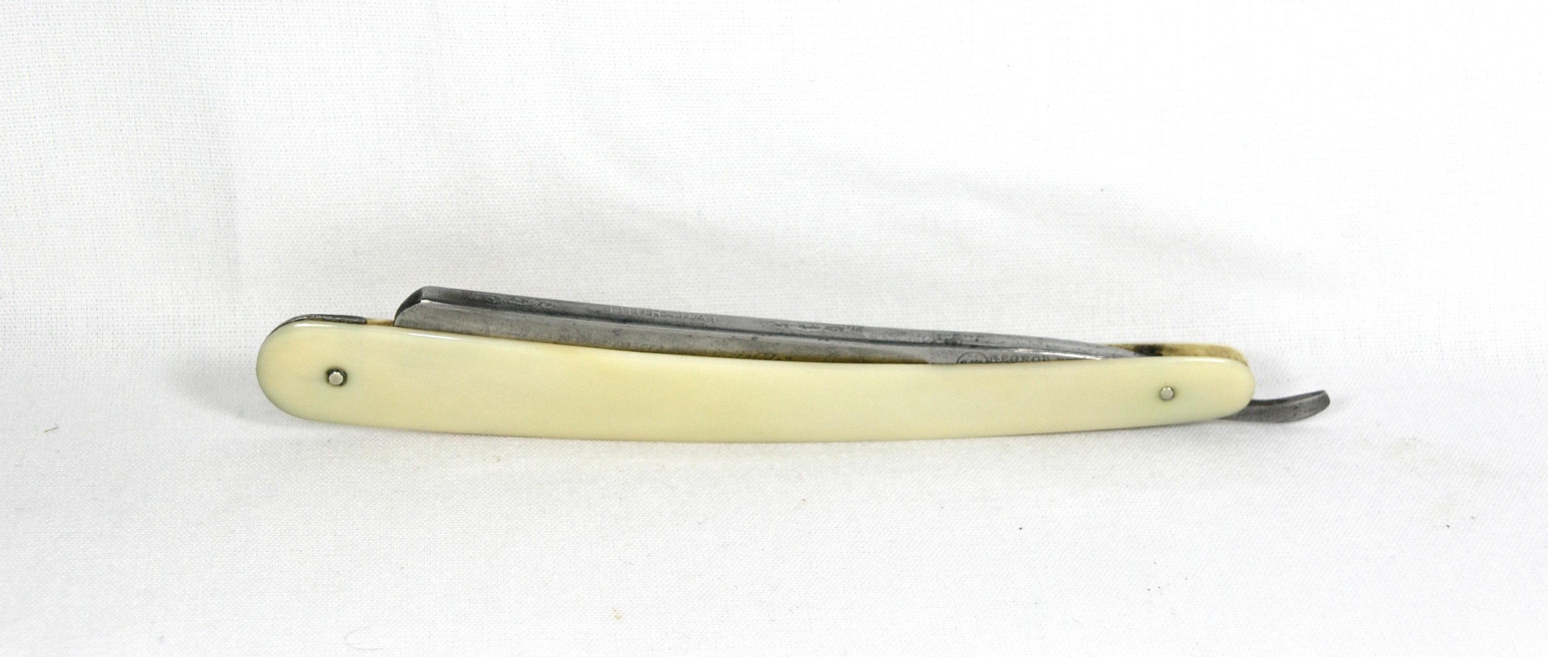 Geo. Butler & Co.  Sheffield, Eng.  Round point blade straight razor with S