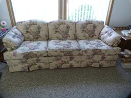Justice upholstered flowered couch. - 83" L