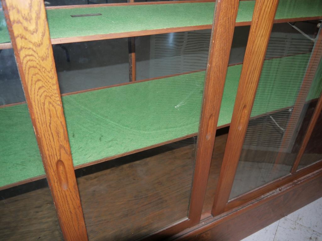 8 ft. Simmons oak display cabinet with sliding glass doors - 2 front & 1 side glass panels removed