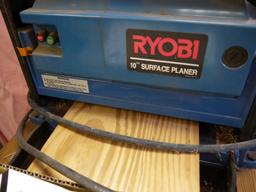 Ryobi AP-10 planer on stand with accessories & manual