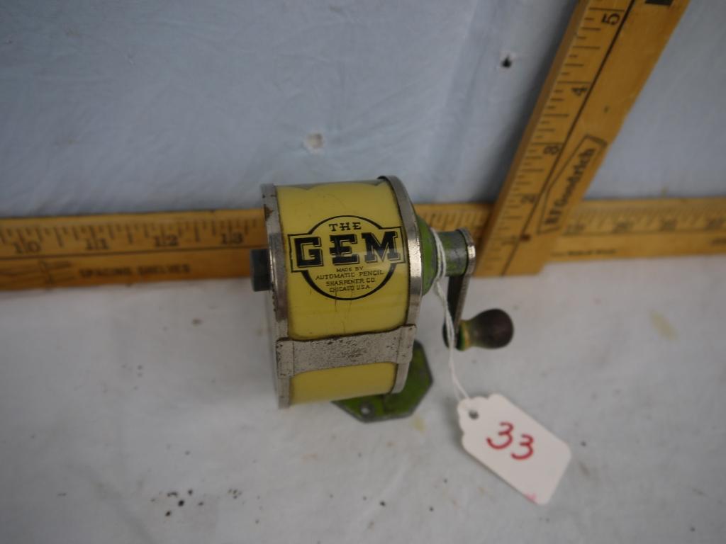 The Gem pencil sharpener, table top mount, 3-1/2" tall, celluloid catch container