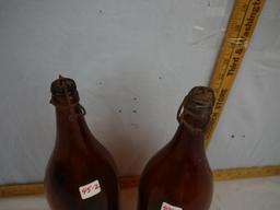 (2) colored glass "picnic" bottles with caps & bails