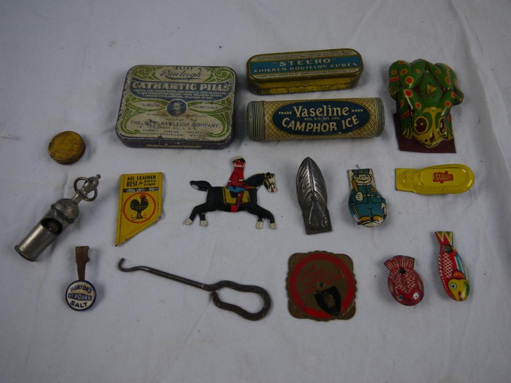 22 metal items: whistles, clickers, tins, button hook,