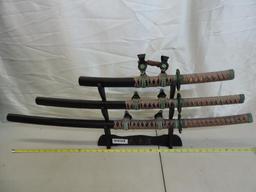 3 Chinese swords with display. 28", 22" and 14" blades.