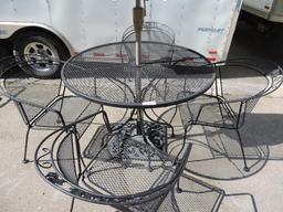 Nice black metal 42x30" patio table with 4 chairs, umbrella and cast iron umbrella base.