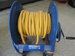 Cox model 1125-4-200-BEXX air hose reel in excellent condition with hose and wheels.