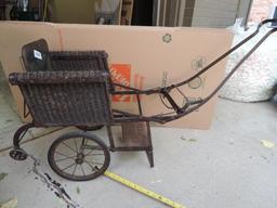 Antique wicker stroller in excellent condition.