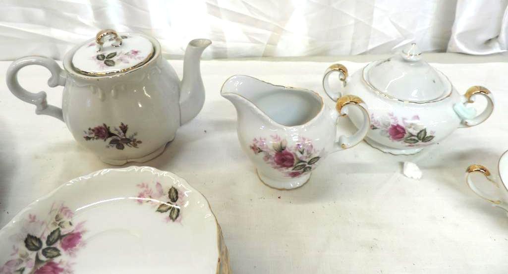 50+ pieces of Harmony House Eugenie Rose fine china.