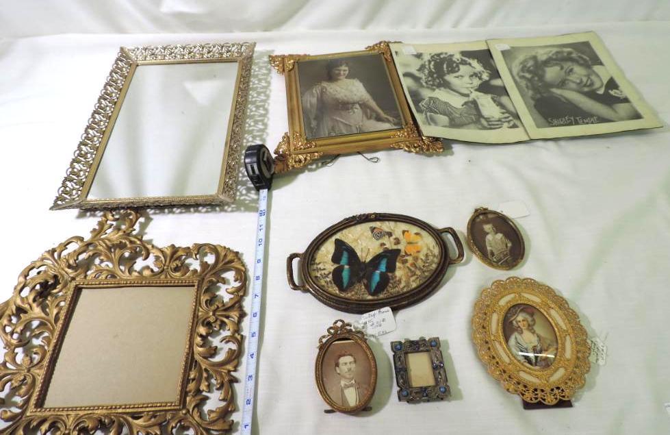 Six antique metal picture frames, wood framed picture, framed butterfly and 2 Shirley Temple prints.