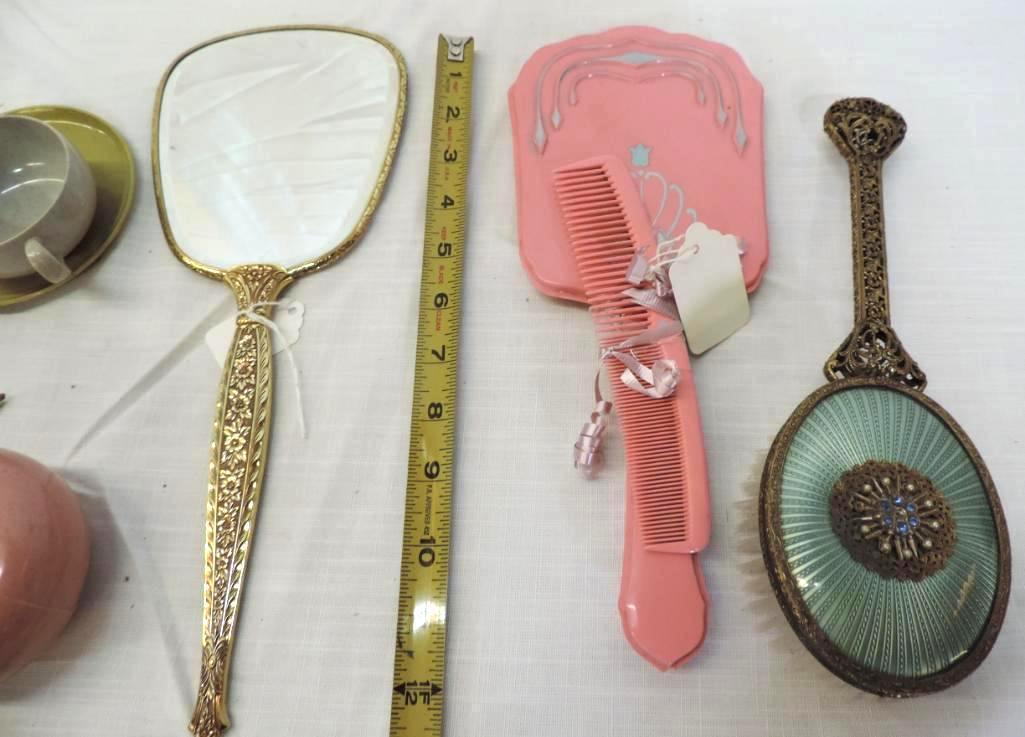 Ornate vintage hand mirrors and Russell Wright plastic child's dishes.