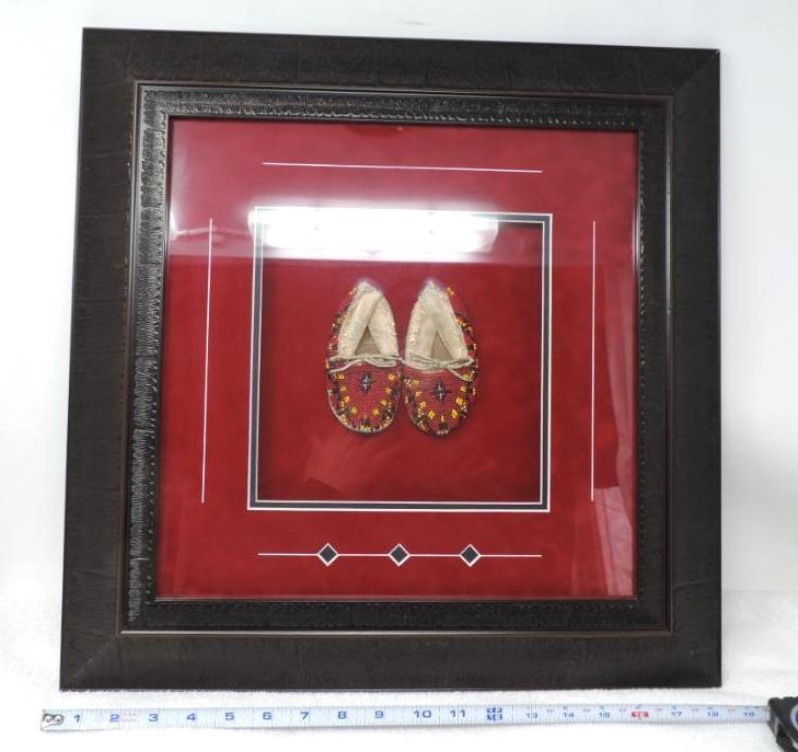 Tracy's studio framed beaded moccasins.