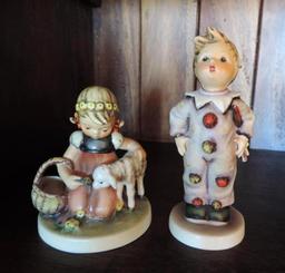 Four Hummel figurines.